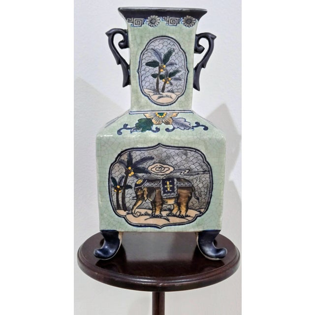 Elevate your space with this striking vintage ceramic vase by Formalities, Baum Bros. Featuring a distinctive elephant and...