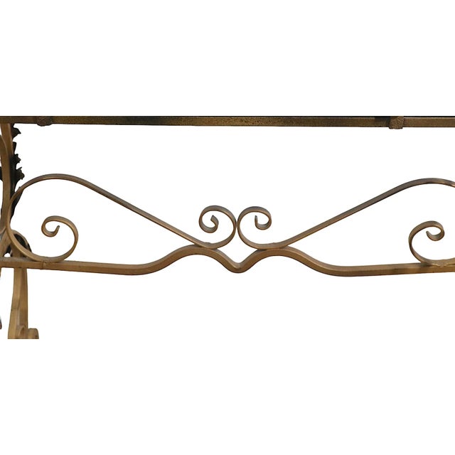 Stylish Art Deco marble top side, or end table, having a thick black marble top, with a decorative wrought iron base, with...