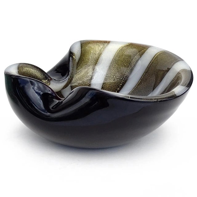 Beautiful vintage Murano hand blown black, gold flecks and white stripes Italian art glass bowl. Documented to designer...