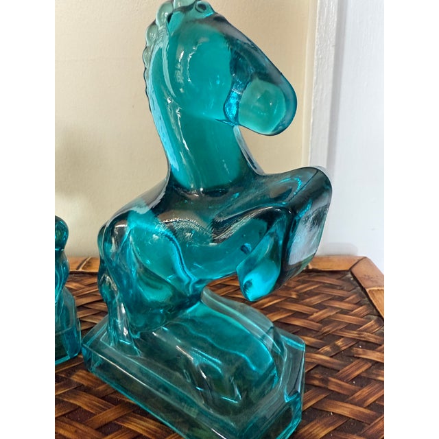 Manufactured by L.E Smith in the mid century, these art deco horse statues could be used as bookends or placed on a pair...