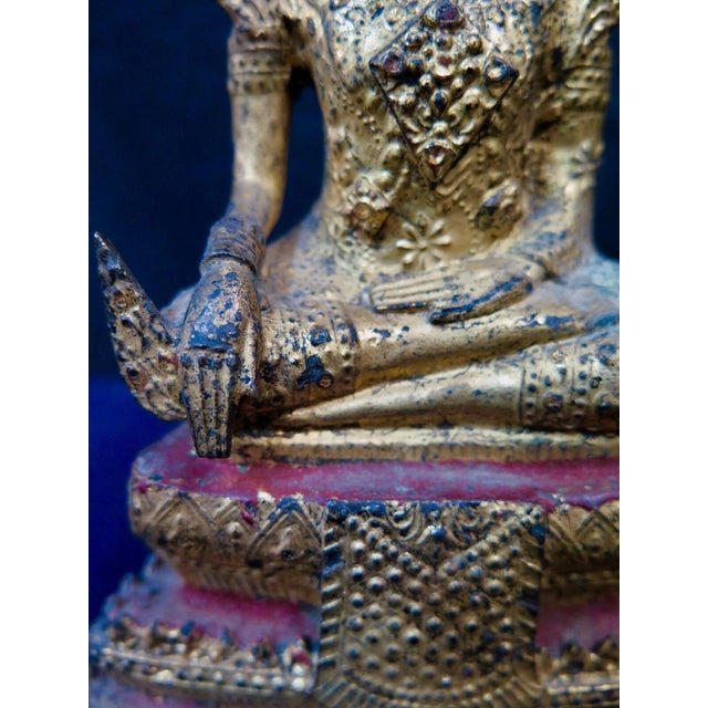 This vintage early 20th century gilt bronze sculpture depicts Bodhisattva in a partial lotus position with hands in the...