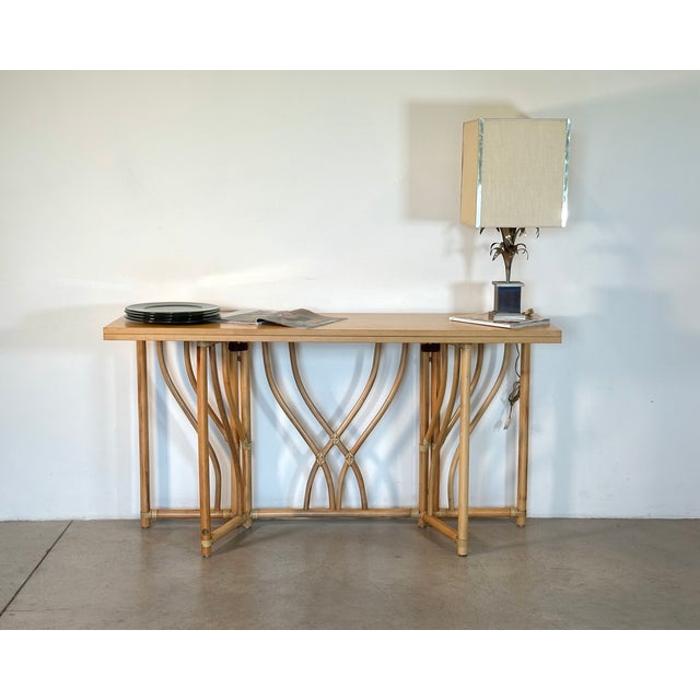 1970s console table, bamboo frame, leather bindings, fold-out wooden top that transforms it into a table, produced by IG....