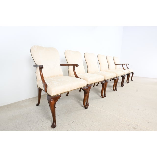 Set of six Baker Furniture Queen Anne style dining chairs, including two armchairs and four side chairs, crafted in solid...