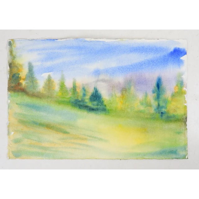 Late 20th century watercolor on paper painting of old farmhouse with laundry line on a cloudy day. There is another...