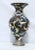 Massive enamel vase with dragon swirling among blue and brown clouds. White ground body with three black body dragons...