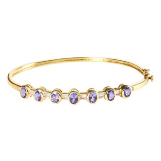14K Yellow Gold Alternating Bezel Set 5MM Oval Shaped Tanzanite and 1/5 Cttw Diamond Bangle Bracelet - Fit's wrists up to 7.25" For Sale