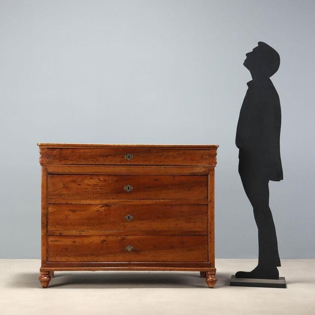 Carlo X walnut chest of drawers, Italian craftsmanship from the second quarter of the 19th century. The structure features...