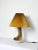Organic shaped table lamp by Axella Stentøj in warm brown colors giving it an earthy appearance. Labeled and signed by...
