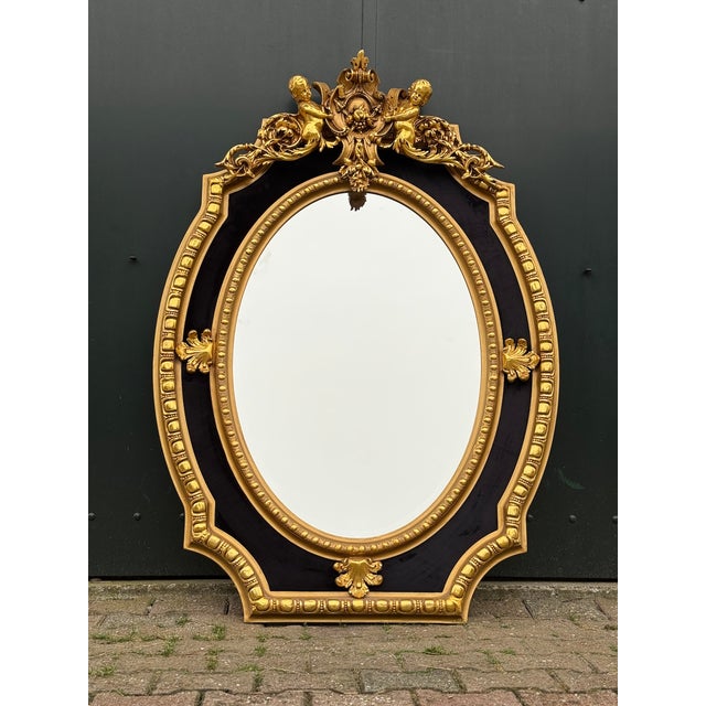 This impressive circa 1980 French Louis XVI–style wall mirror combines classical neoclassical symmetry with sculptural...