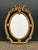 This impressive circa 1980 French Louis XVI–style wall mirror combines classical neoclassical symmetry with sculptural...
