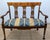 This exquisite Bench , rendered in a Neoclassical Style, crafted from a sumptuous mahogany. The bench is adorned with...