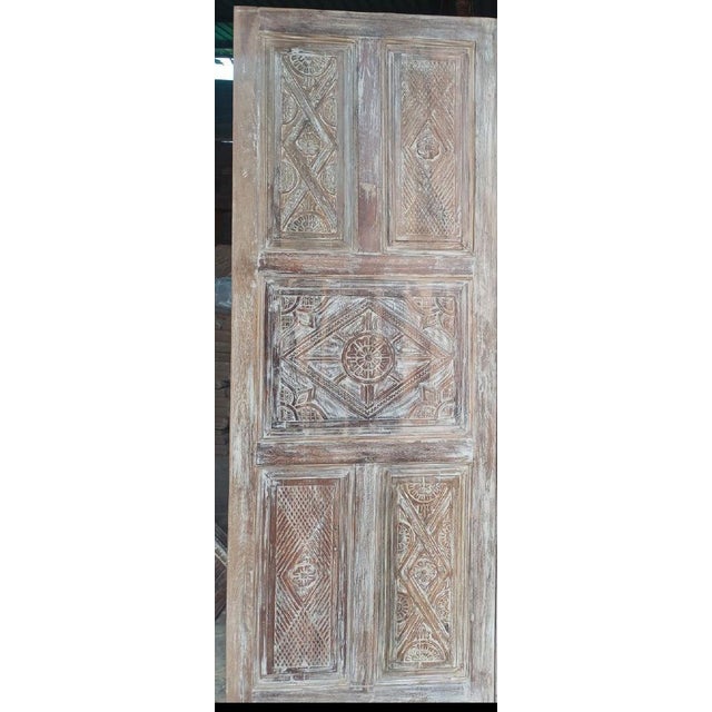 An exquisite set of vintage carved doors crafted from reclaimed wood, finished in a soft whitewashed patina that...