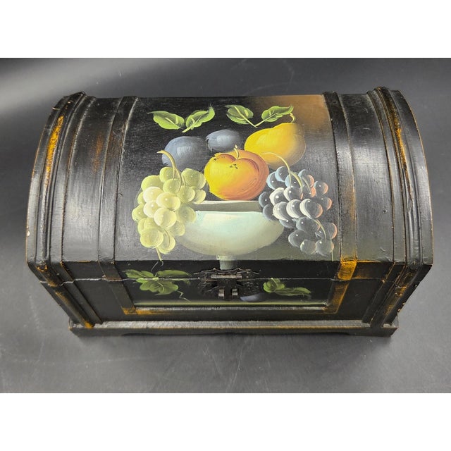 This is a vintage hand painted wooden dome lidded hinged table chest. It has the original metal locking mechanism, a metal...