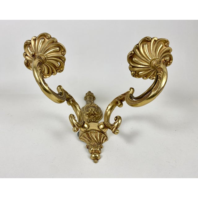 Vintage Twin-Arm bronze wall lamp from Belgium imitating classic candelabra, circa 1960s. Unique stamped wall light...