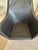 Stylish black leather and steel swivel club chairs attributed to Danish maker Bolia, having pedestal with round steel...