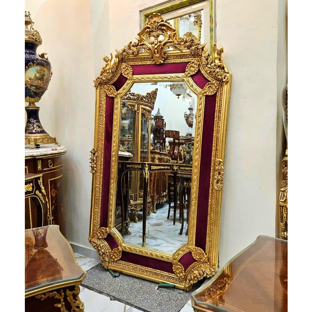 Elevate your interior with this stunning French Baroque-style wall mirror, featuring an elaborate frame finished in...