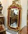 Elevate your interior with this stunning French Baroque-style wall mirror, featuring an elaborate frame finished in...