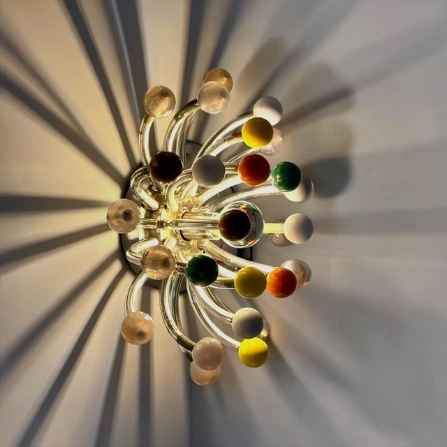 Original Pistillino wall lamp designed by Studio Tetrarch and manufactured by Valenti in Milan during the 1970s. Named...