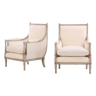 A Pair of Louis XVI Style Grey Painted and Partial Gilt Wood Upholstered Bergère Chairs, C. 1940. For Sale