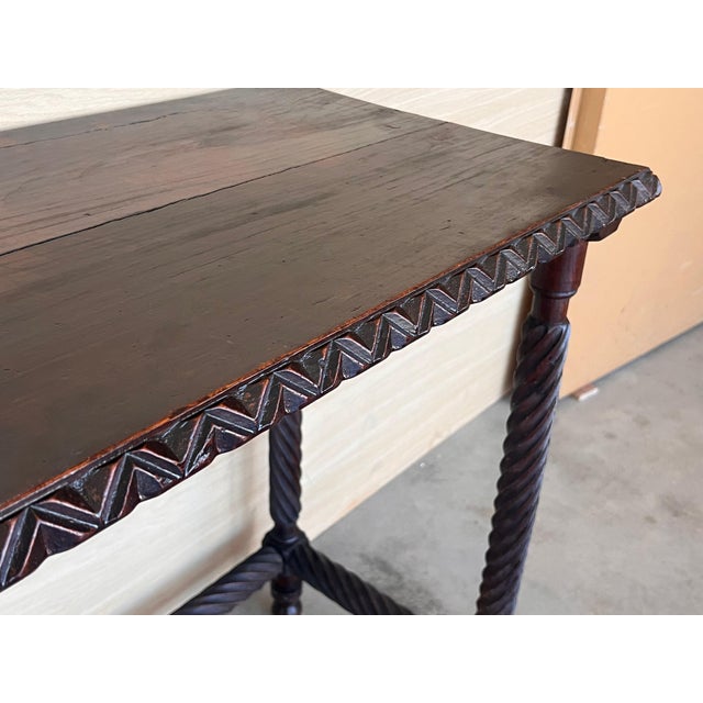 19th Spanish side table with cared Solomonic turned legs and carved edges in top