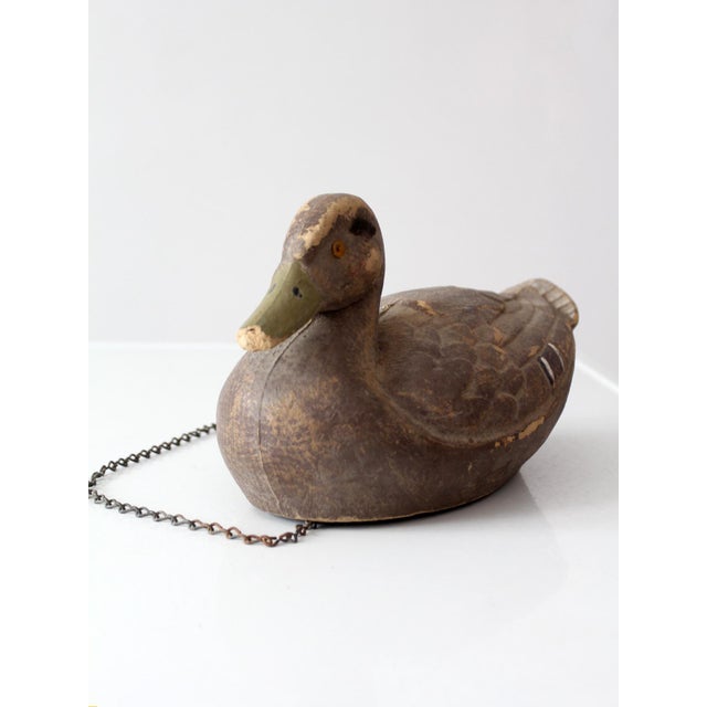 A vintage 1950s General Fibre Ariduk mallard hen decoy with a molded fiber body, glass eyes, detailed feathering, and...