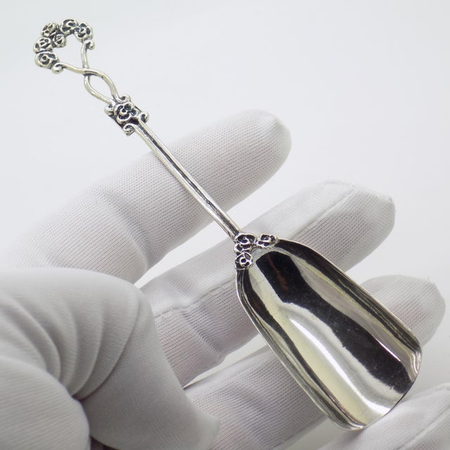 This usable large sugar spoon was handmade in Arezzo, Tuscany, Italy, during the 1980s/1990s by Gemini silversmiths....