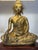 An elegant pair of lamps, each composed of a sculpture of a seated Buddha in meditation, crafted from finely cast and...