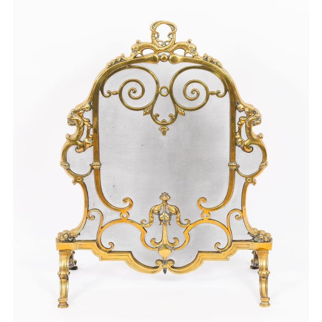 This is a superb and very decorative French Louis revival brass and mesh fire-screen, circa 1860 in date. The shield...