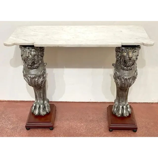 English Regency Style Marble Top Zinc Lion Caryatid Console Table England, circa 1900s With canted cornered white marble...