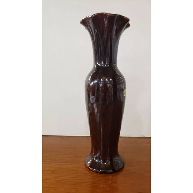 This is a Mid Century Royal Haeger Brown Glaze Black Spotted Vase. It measures 10" high and 3 3/8“ wide at the rim. The...