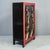 With a striking color palette and classic Chinese style, this elegant red and black lacquer cabinet features a charming...