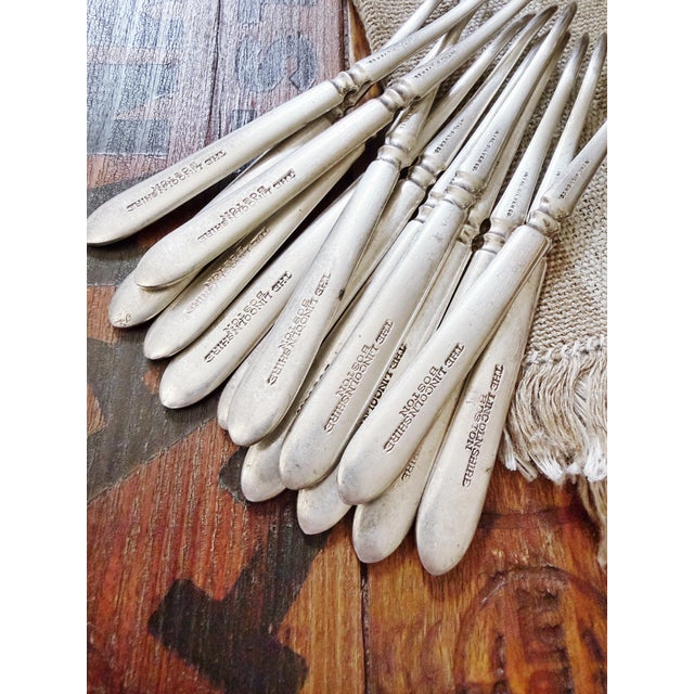 A lovely and rare set of 12 circa 1920s nut or seafood picks from the historic Hotel Lincolnshire in Boston,...