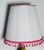 Beautiful white pleated lamp shade decorated with pink fringes and silk ribbon. Bottom 16”, Top 10” Height 14”.
