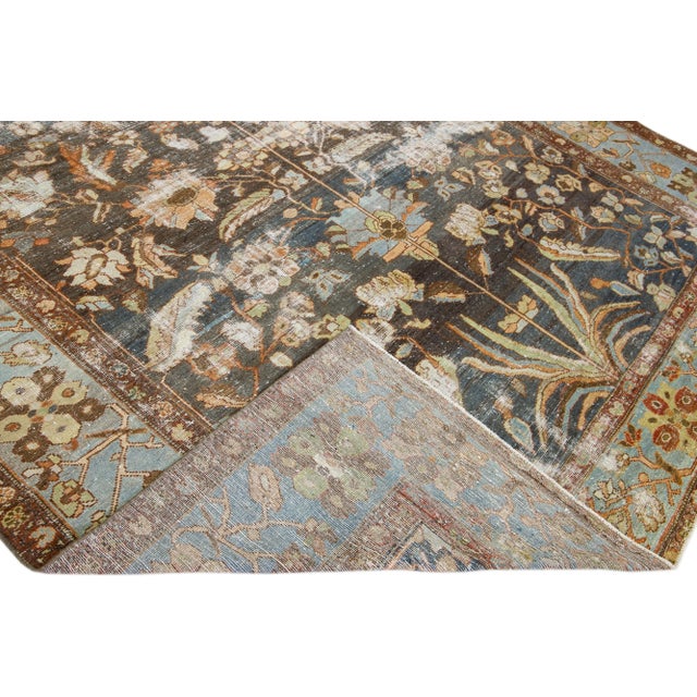 Beautiful antique Malayer hand-knotted wool runner with a blue field. This Malayer piece has a light blue-designed frame...