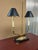Handcrafted two-light table lamp featuring an ornate solid brass construction with detailed cast decorative elements. The...