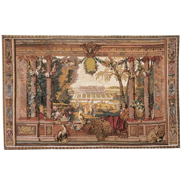 This tapestry is one from a series depicting French Royal Palaces and representing the twelve months of the year. Over the...