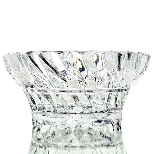 A sculptural 9-inch cut crystal bowl from Mikasa’s “Rainier” pattern, notable for its thick, heavy walls and dynamic...