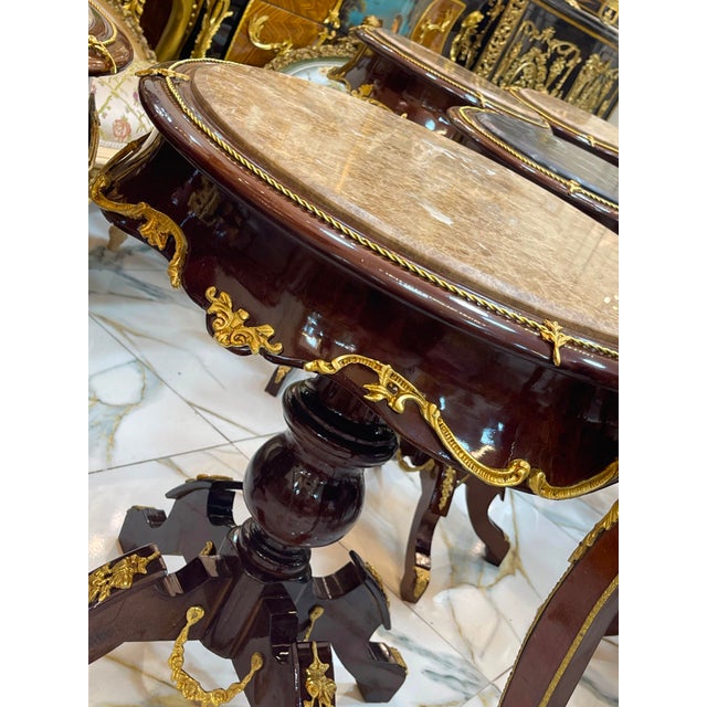 Bring timeless French elegance into your home with this exquisite Louis XVI-inspired round side table. Crafted from...