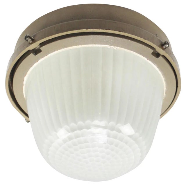 French industrial wall / ceiling lamp by holophane, france, model ce100 beige cast iron with frosted cut glass. e27 / e26...