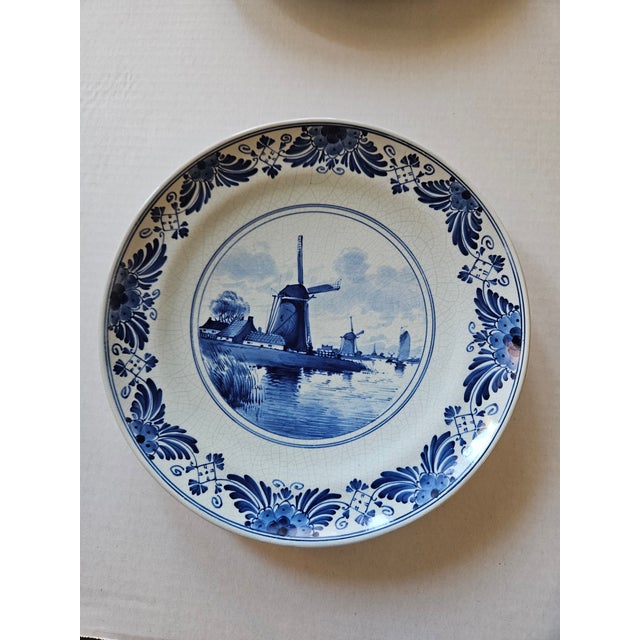 Very rare! Each of these two plates is a work of art. The Windmill plate was hand painted by the artist A.E.V. Roggeveen...