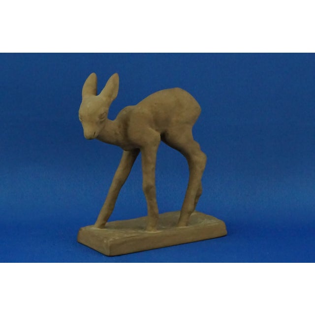 Fabulous majolica terracotta sculpture depicting a fawn, signed under the base with the mark of the famous German...