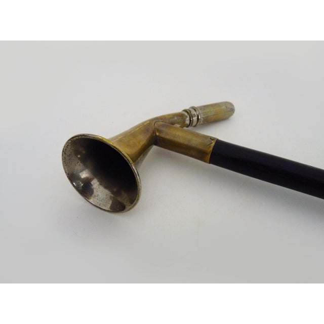 Early 20th-century wooden walking stick with a built-in weight system Walking stick with a hunting horn handle The handle...