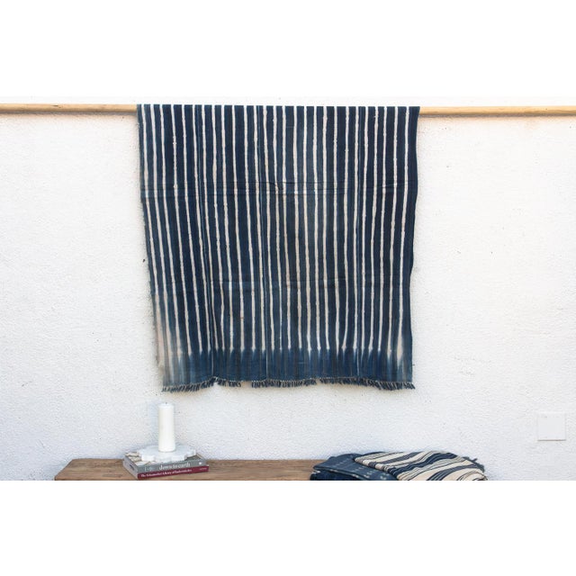Hand-woven by master weavers of the Mossi and Dioula traditions in Burkina Faso, West Africa, these vintage textiles are...