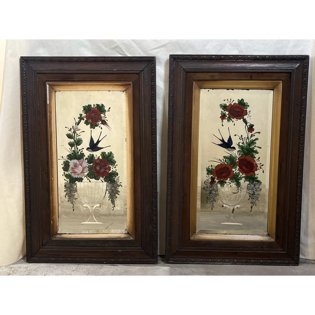 A lovely pair of Victorian reverse painted and cut glass decorated mirrors from the late 19th century. The mirrors have...