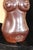 A clear glass bottle shaped like a woman's bust. Lots of detail. Reddish brown glossy glaze. Unique and in perfect...