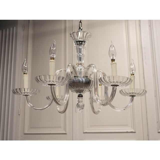 Elegant and refined 1970s Murano glass chandelier, attributed to Venini, one of the most renowned glassmakers from Murano,...