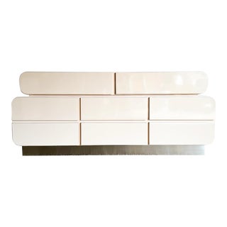 Postmodern Galactic Light Pink Lacquer Laminate Waterfall Dresser With Brushed Metal Base For Sale