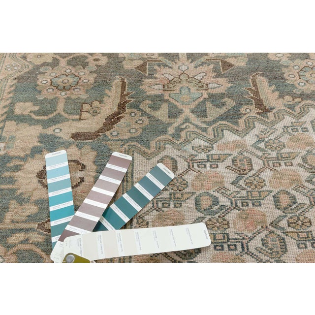 A hand-knotted wool antique Persian Malayer rug dating back to 1920. The main field displays a large medallion with...