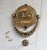 Vintage brass door knocker featuring a dragon. Crafted from solid brass. Features an ornate central emblem, a winged...