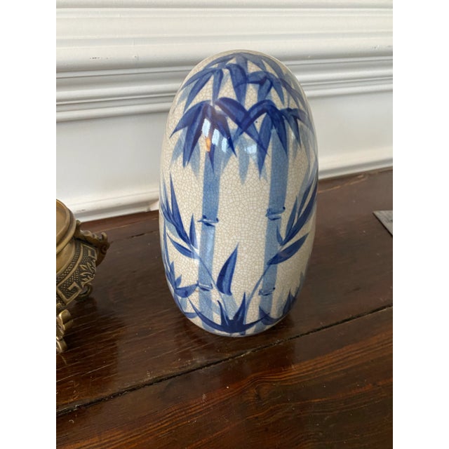 Vintage Chinoiserie Blue and White Ceramic Egg on Brass Stand For Sale - Image 4 of 6